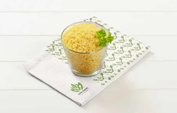 A bowl with millets with table mat.